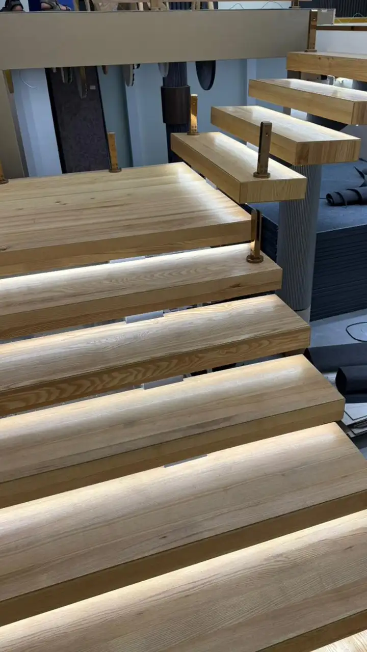 Pale ash treads with concealed lighting under each nosing