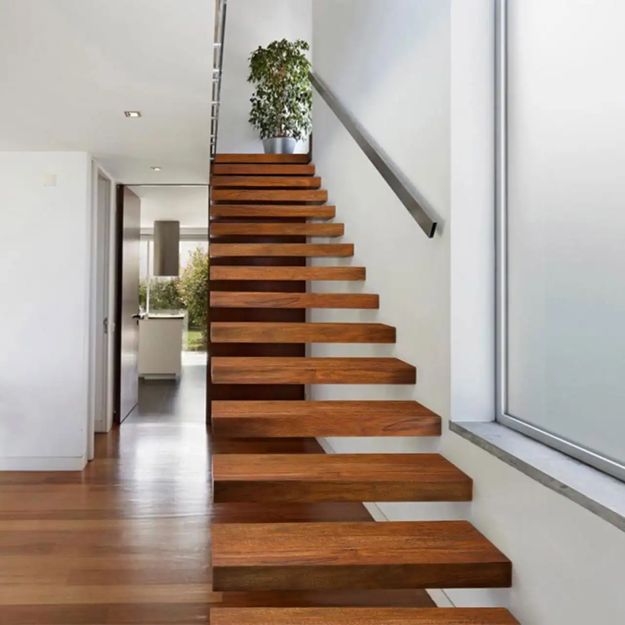 Cantilevered solid wood treads fixed straight into the wall