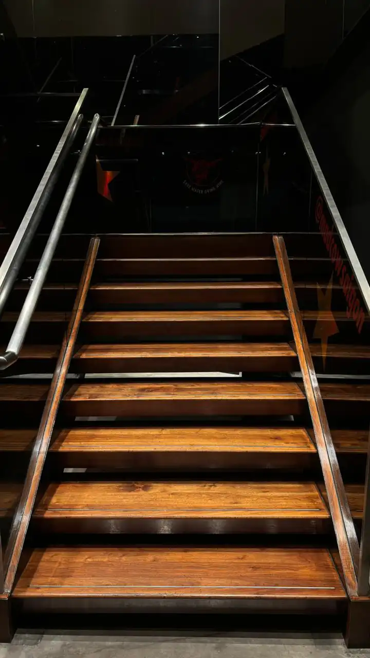 Wide wooden staircase in a restaurant