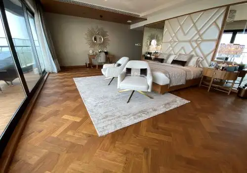 Bedroom with herringbone parquet flooring