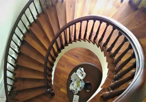 Spiral staircase and wooden floor seen from above