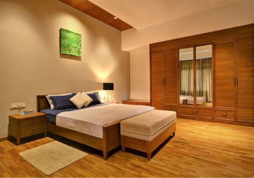 Bedroom with warm wooden flooring